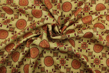 Load image into Gallery viewer, This multi purpose fabric features a floral medallion design in the colors of burnt orange, spice, deep red and green on a khaki background.  It can be used for several different statement projects including window accents (drapery, curtains and swags), decorative pillows, hand bags, bed skirts, duvet covers, upholstery and craft projects.  It has a soft workable feel yet is stable and durable.
