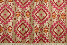 Load image into Gallery viewer, This multi purpose cotton/linen blend fabric features an ikat design in mulberry, pink, orange and brown.  It can be used for several different statement projects including window accents (drapery, curtains and swags), decorative pillows, hand bags, bed skirts, duvet covers, upholstery and craft projects.  It has a soft workable feel yet is stable and durable with 5,000 double rubs. 
