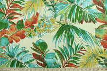 Load image into Gallery viewer, Sengala features a large tropical leaf design in green, blue, red and yellow against an ivory background.  This versatile, long-lasting fabric can withstand up to 500 hours of sunlight.  It is perfect for lounge cushions, pool furniture, tablecloths, decorative pillows and upholstery projects.  This fabric has a slightly stiff feel but is easy to work with.  
