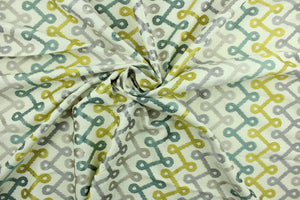 Medicago is a contemporary geometric design embroidered in citrus yellow, teal, champagne and light purple on an off white background.  Use this for light upholstery, pillows, bedding and window treatments.  