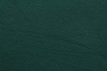 Load image into Gallery viewer, Hunter is a solid, dark green, cotton jersey fabric, has a 4-way stretch that is soft, durable, breathable and will allow movements of the body.  Uses include t-shirts, sportswear, loungewear, leggings, children&#39;s apparel, bedding and sheets.  We offer a variety of jersey fabrics.

