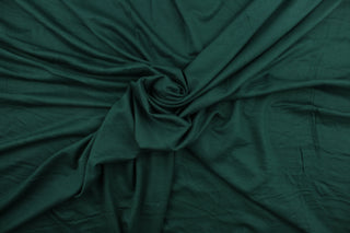 Hunter is a solid, dark green, cotton jersey fabric, has a 4-way stretch that is soft, durable, breathable and will allow movements of the body.  Uses include t-shirts, sportswear, loungewear, leggings, children's apparel, bedding and sheets.  We offer a variety of jersey fabrics.