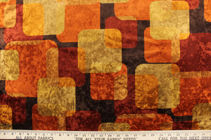  This velvet features a geometric design in orange, bronze, gold, brown and rust red. 