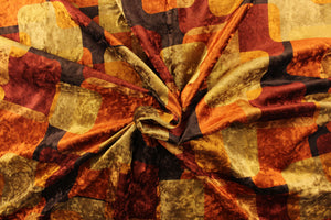  This velvet features a geometric design in orange, bronze, gold, brown and rust red. 