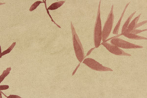 This velvet features a leaf design in mauve, and maroon against a pale beige  . 