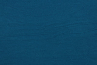 This turquoise cotton jersey fabric, has a 4-way stretch that is soft, durable, breathable and will allow movements of the body.  Uses include t-shirts, sportswear, loungewear, leggings, children's apparel, bedding and sheets.  We offer a variety of jersey fabrics.