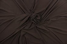 Load image into Gallery viewer, This chocolate brown, cotton jersey fabric, has a 4-way stretch that is soft, durable, breathable and will allow movements of the body.  Uses include t-shirts, sportswear, loungewear, leggings, children&#39;s apparel, bedding and sheets.  We offer a variety of jersey fabrics.
