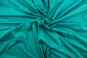 This aqua cotton jersey fabric, has a 4-way stretch that is soft, durable, breathable and will allow movements of the body.  Uses include t-shirts, sportswear, loungewear, leggings, children's apparel, bedding and sheets.  We offer a variety of jersey fabrics.