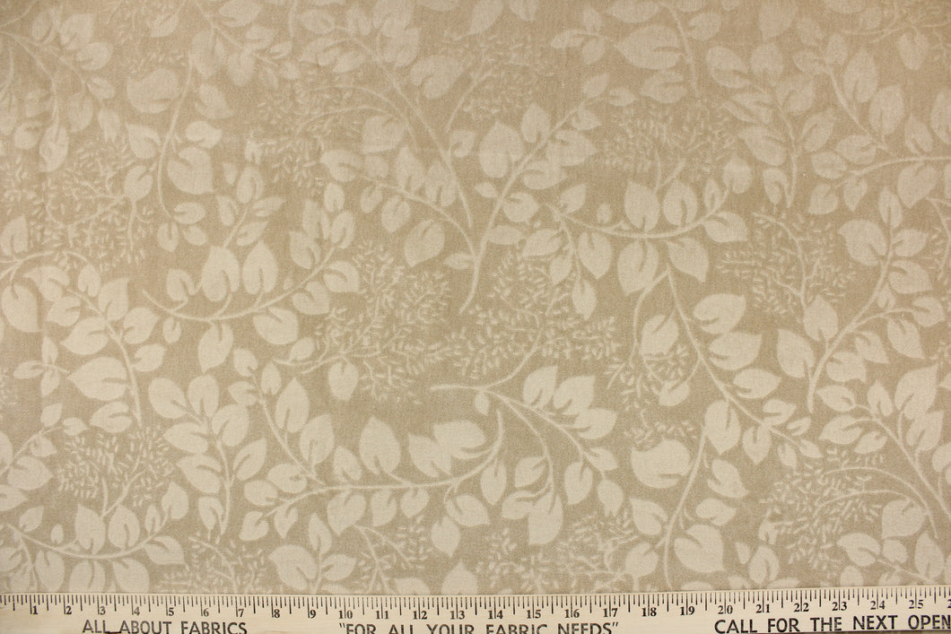 An upholstery velvet featuring a floral design in a tone on tone khaki.