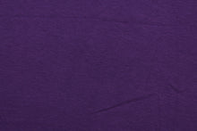 Load image into Gallery viewer, Grape is a solid purple cotton jersey fabric, has a 4-way stretch that is soft, durable, breathable and will allow movements of the body.  Uses include t-shirts, sportswear, loungewear, leggings, children&#39;s apparel, bedding and sheets.  We offer a variety of jersey fabrics.
