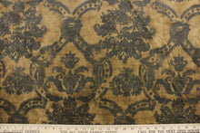 Load image into Gallery viewer, This velvet features a unique design in dark gray or black against a taupe background  .
