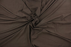 This brown cotton jersey fabric, has a 4-way stretch that is soft, durable, breathable and will allow movements of the body.  Uses include t-shirts, sportswear, loungewear, leggings, children's apparel, bedding and sheets.  We offer a variety of jersey fabrics.