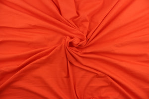 This orange cotton jersey fabric, has a 4-way stretch that is soft, durable, breathable and will allow movements of the body.  Uses include t-shirts, sportswear, loungewear, leggings, children's apparel, bedding and sheets.  We offer a variety of jersey fabrics.