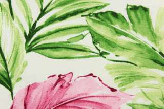 This outdoor fabric features a tropical leaf design in pink, hot pink, green, light green, and white 