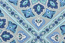 Load image into Gallery viewer, This outdoor print features a medallion design in blue, light blue, green, white, gray, and black  . 
