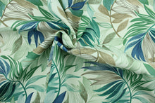 Load image into Gallery viewer, This Solarium outdoor decorative print features a large tropical leaf design in teal, sage, taupe and brown on an ivory background.  This versatile, long-lasting fabric can withstand up to 500 hours of sunlight, water and stain resistant and has 10,000 double rubs. 
