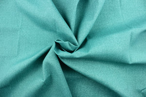  An outdoor fabric in a beautiful solid turquoise . 