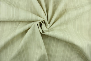 This Solarium outdoor fabric features a duotone stripe design in sand.  This versatile, long-lasting fabric can withstand up to 500 hours of sunlight, water and stain resistant and has 10,000 double rubs.  It is perfect for lounge cushions, pool furniture, tablecloths, decorative pillows and upholstery projects.  This fabric has a slightly stiff feel but is easy to work with.  