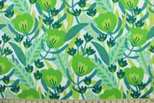 Load image into Gallery viewer, This Solarium outdoor decorative print features a medley of flowers and leaves in shades of blue and green against a white background.  This versatile, long-lasting fabric can withstand up to 500 hours of sunlight, water and stain resistant and has 10,000 double rubs.  It is perfect for lounge cushions, pool furniture, tablecloths, decorative pillows and upholstery projects.  This fabric has a slightly stiff feel but is easy to work with.  
