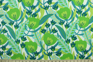 This Solarium outdoor decorative print features a medley of flowers and leaves in shades of blue and green against a white background.  This versatile, long-lasting fabric can withstand up to 500 hours of sunlight, water and stain resistant and has 10,000 double rubs.  It is perfect for lounge cushions, pool furniture, tablecloths, decorative pillows and upholstery projects.  This fabric has a slightly stiff feel but is easy to work with.  