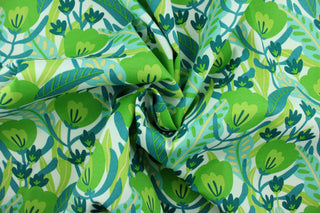 This Solarium outdoor decorative print features a medley of flowers and leaves in shades of blue and green against a white background.  This versatile, long-lasting fabric can withstand up to 500 hours of sunlight, water and stain resistant and has 10,000 double rubs.  It is perfect for lounge cushions, pool furniture, tablecloths, decorative pillows and upholstery projects.  This fabric has a slightly stiff feel but is easy to work with.  