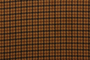 This velvet features a houndstooth plaid design in tan, black and brown  .