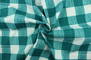 This Solarium outdoor decorative print features a plaid design in peacock green and white.  This versatile, long-lasting fabric can withstand up to 500 hours of sunlight, water and stain resistant and has 15,000 double rubs.  It is perfect for lounge cushions, pool furniture, tablecloths, decorative pillows and upholstery projects.  This fabric has a slightly stiff feel but is easy to work with.  