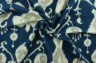 Java features an ikat design in pale gray and ivory on a navy blue  background.  It can be used for several different statement projects including window accents (drapery, curtains and swags), decorative pillows, cornice boards, bed skirts, duvet covers, upholstery and craft projects.  It has a soft workable feel yet is stable and durable with 17,000 double rubs. .