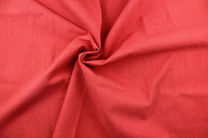 A mock linen in a solid rich coral red with a light backing.