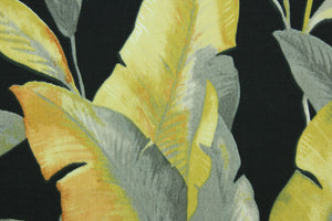 This Solarium outdoor decorative print features large banana leaves in shades of gray and golden yellow against a black background.  This versatile, long-lasting fabric can withstand up to 500 hours of sunlight, water and stain resistant and has 15,000 double rubs.  It is perfect for lounge cushions, pool furniture, tablecloths, decorative pillows and upholstery projects.  This fabric has a slightly stiff feel but is easy to work with.  