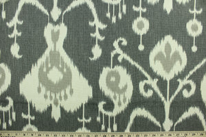 Java features an ikat design in pale gray and ivory on a pewter background.  It can be used for several different statement projects including window accents (drapery, curtains and swags), decorative pillows, cornice boards, bed skirts, duvet covers, upholstery and craft projects.  It has a soft workable feel yet is stable and durable with 17,000 double rubs. .