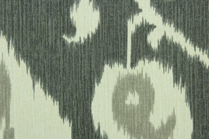 Java features an ikat design in pale gray and ivory on a pewter background.  It can be used for several different statement projects including window accents (drapery, curtains and swags), decorative pillows, cornice boards, bed skirts, duvet covers, upholstery and craft projects.  It has a soft workable feel yet is stable and durable with 17,000 double rubs. .