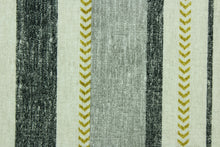 Load image into Gallery viewer,  This Solarium outdoor decorative print features a multi width stripe design in black, gray, olive green and natural.  This versatile, long-lasting fabric can withstand up to 500 hours of sunlight, water and stain resistant and has 15,000 double rubs.  It is perfect for lounge cushions, pool furniture, tablecloths, decorative pillows and upholstery projects.  This fabric has a slightly stiff feel but is easy to work with.  
