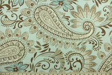 Load image into Gallery viewer, Novodari is a multi use fabric featuring a modern paisley and floral design in brown, taupe, cream and aqua blue.  It can be used for several different statement projects including window accents (drapery, curtains and swags), decorative pillows, hand bags, bed skirts, duvet covers, upholstery and craft projects.  It has a soft workable feel yet is stable and has a durability rating of 15,000 double rubs.
