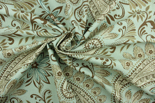 Novodari is a multi use fabric featuring a modern paisley and floral design in brown, taupe, cream and aqua blue.  It can be used for several different statement projects including window accents (drapery, curtains and swags), decorative pillows, hand bags, bed skirts, duvet covers, upholstery and craft projects.  It has a soft workable feel yet is stable and has a durability rating of 15,000 double rubs.