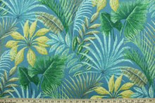 Load image into Gallery viewer, This fabric features large exotic tropical flowers and foliage in shades of teal, yellow, green, blue and brown.  It is perfect for outdoor settings or indoors in a sunny room.  It can withstand up to 500 hours of sunlight and is water and stain resistant and has a rating of 60,000 rubs.  Perfect for porches, patios and pool side.  Uses include toss pillows, cushions, upholstery, tote bags and more.  
