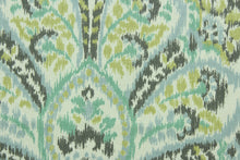 Load image into Gallery viewer,  Provence is a large scale framed medallion design in spa green, grey, chartreuse and light blueish grey on an ivory background.  It can be used for several different statement projects including window accents (drapery, curtains and swags), decorative pillows, cornice boards, bed skirts, duvet covers, upholstery and craft projects.  It has a soft workable feel yet is stable and durable with 17,000 double rubs.
