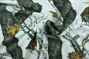 This ultra soft, medium weight printed fleece is the go to fabric for warmth.  The camouflage design features realistic branches and leaves in the colors of green, black, brown and white and is perfect for creating jackets, vests, scarves, gloves, throws, bedding and more! 