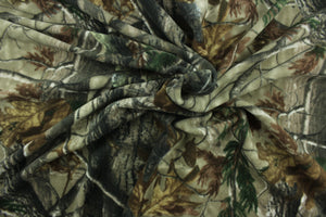 This ultra soft, medium weight printed fleece is the go to fabric for warmth.  The camouflage design features branches and leaves in the colors of green, gray, black and brown.  It is perfect for creating jackets, vests, scarves, gloves, throws, bedding and more! 