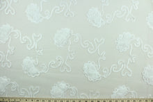 Load image into Gallery viewer, This fabric features a beautiful embroidered scroll line with embossed roses.  The sheer fabric is see through with a nice flowy drape.  It is perfect for special occasion apparel, costumes, overlays, table tops, décor, sheer curtains and more.  
