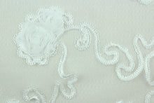 Load image into Gallery viewer, This fabric features a beautiful embroidered scroll line with embossed roses.  The sheer fabric is see through with a nice flowy drape.  It is perfect for special occasion apparel, costumes, overlays, table tops, décor, sheer curtains and more.  
