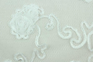 This fabric features a beautiful embroidered scroll line with embossed roses.  The sheer fabric is see through with a nice flowy drape.  It is perfect for special occasion apparel, costumes, overlays, table tops, décor, sheer curtains and more.  
