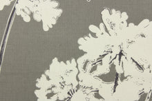 Load image into Gallery viewer, This fabric features a floral design in a dull white against a gray background.
