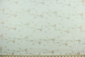 This fabric features a beautiful embroidered floral vine design in pink and green against a white background.  The sheer fabric is see through with a nice flowy drape.  It is perfect for special occasion apparel, costumes, overlays, table tops, décor, sheer curtains and more.  