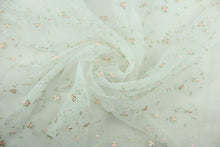 Load image into Gallery viewer, This fabric features a beautiful embroidered floral vine design in pink and green against a white background.  The sheer fabric is see through with a nice flowy drape.  It is perfect for special occasion apparel, costumes, overlays, table tops, décor, sheer curtains and more.  
