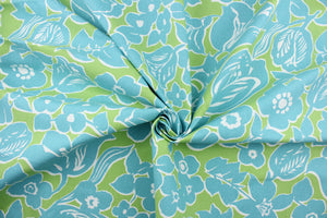 The cabana has a bright green background with aqua blue flowers with white outlines. 
