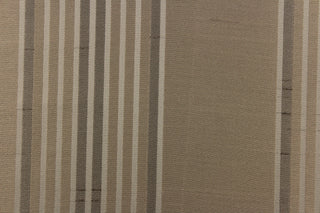 This light weight  fabric offers a formal feel. Featuring a  vertical striped pattern  in colors of taupe with a  slight sheen to enhance the rich colors and overall design. 