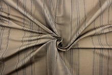 Load image into Gallery viewer, This light weight  fabric offers a formal feel. Featuring a  vertical striped pattern  in colors of taupe with a  slight sheen to enhance the rich colors and overall design. 

