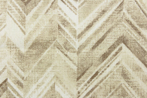  This fabric features a chevron design in shades of brown, beige, taupe, and white . 