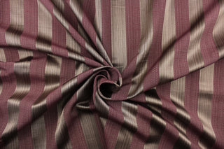 This stunning yarn dyed fabric features a  wide striped pattern in brown and medium purple . 